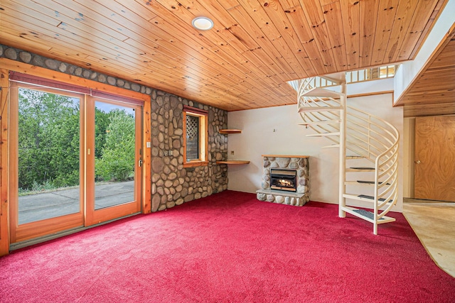 884 N Gavord Rd, Sterling, MI 48659 - unfurnished living room with carpet floors, a stone fireplace, and wooden ceiling
