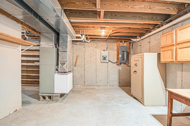 884 N Gavord Rd, Sterling, MI 48659 - unfinished below grade area featuring electric panel and heating unit