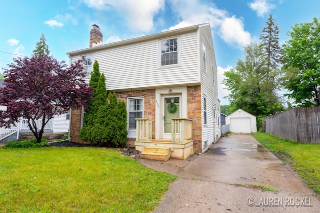 839 Joslin St SE, Grand Rapids, MI 49507 - colonial-style house with driveway, a garage, a chimney, and an outdoor structure