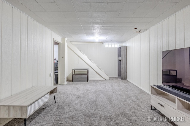 839 Joslin St SE, Grand Rapids, MI 49507 - below grade area featuring carpet floors and wooden walls