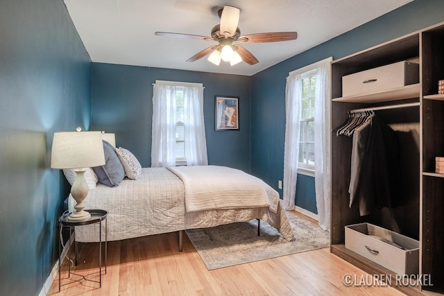 839 Joslin St SE, Grand Rapids, MI 49507 - bedroom featuring wood finished floors, baseboards, and a ceiling fan