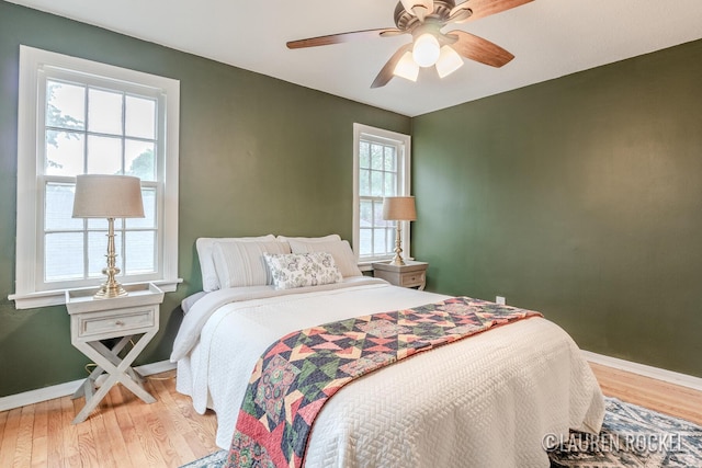 839 Joslin St SE, Grand Rapids, MI 49507 - bedroom with wood finished floors, baseboards, and a ceiling fan