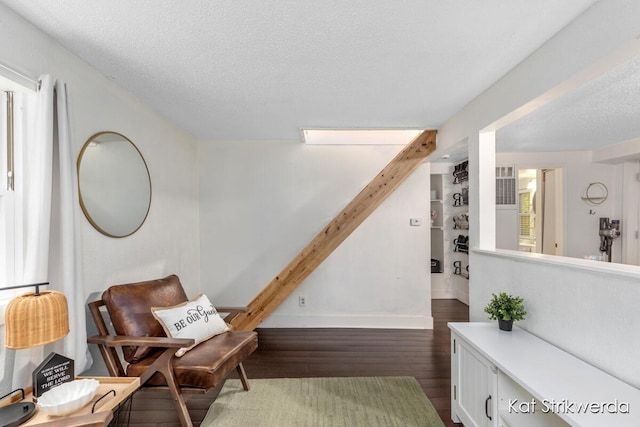 1900 Kinney Ave NW, Grand Rapids, MI 49534 - living area featuring wood finished floors, a textured ceiling, and baseboards