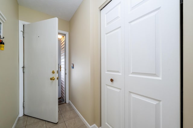 5632 N Watervliet Rd Unit 22, Watervliet, MI 49098 - corridor with light tile patterned floors and baseboards