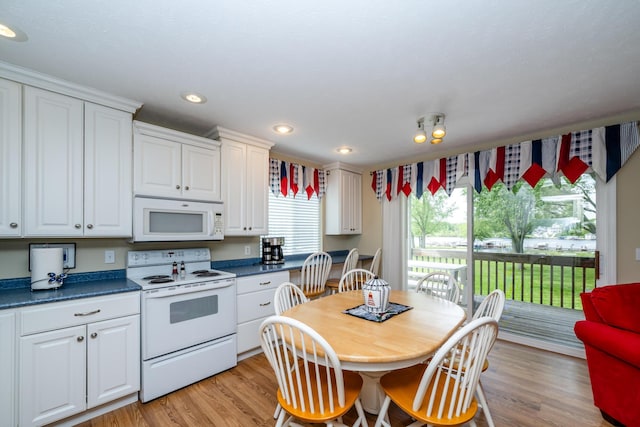 5632 N Watervliet Rd Unit 22, Watervliet, MI 49098 - kitchen featuring white appliances, white cabinetry, dark countertops, and recessed lighting