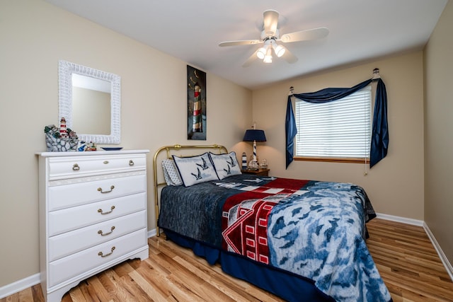 5632 N Watervliet Rd Unit 22, Watervliet, MI 49098 - bedroom featuring light wood-type flooring, baseboards, and ceiling fan