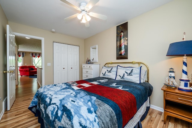 5632 N Watervliet Rd Unit 22, Watervliet, MI 49098 - bedroom featuring baseboards, light wood-type flooring, a closet, and ceiling fan