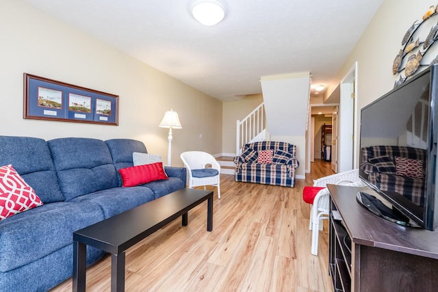 5632 N Watervliet Rd Unit 22, Watervliet, MI 49098 - living room featuring stairs and light wood-style floors