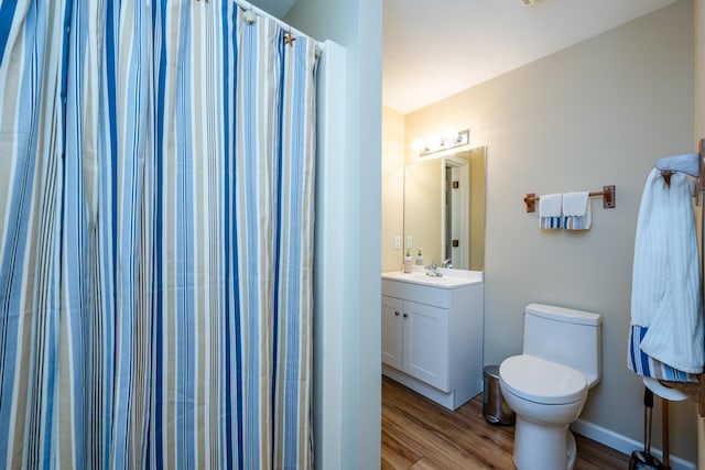 5632 N Watervliet Rd Unit 22, Watervliet, MI 49098 - bathroom with toilet, vanity, and wood finished floors