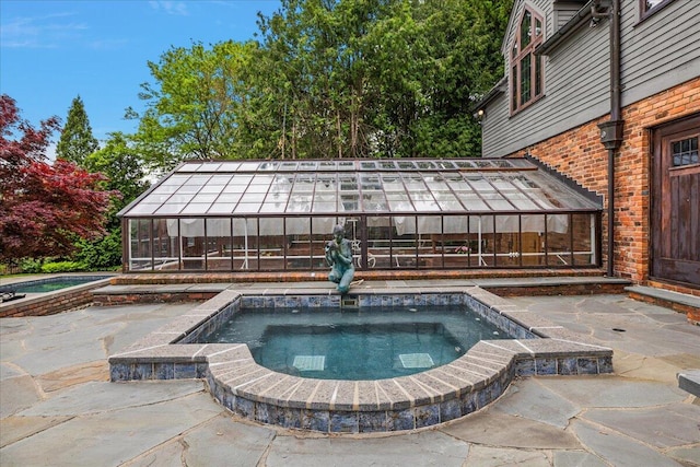 490 E Long Lake Rd, Bloomfield Hills, MI 48304 - view of swimming pool with an in-ground hot tub, a patio, and a greenhouse
