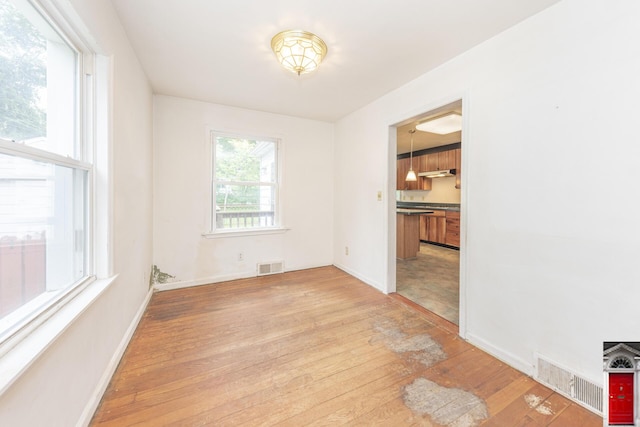 1506 Chandler Rd, Ann Arbor, MI 48105 - spare room with light wood-type flooring and baseboards