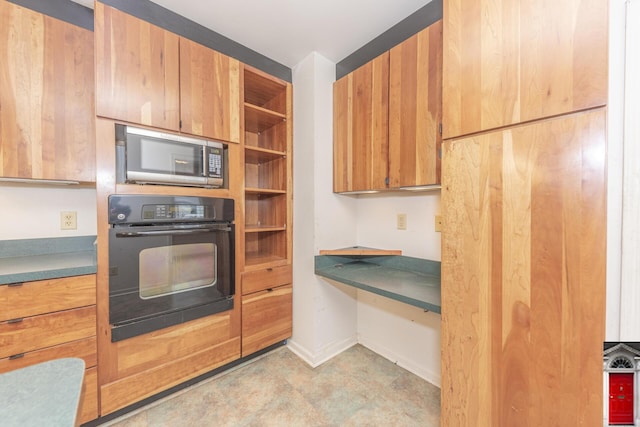 1506 Chandler Rd, Ann Arbor, MI 48105 - kitchen with oven, stainless steel microwave, baseboards, open shelves, and brown cabinets