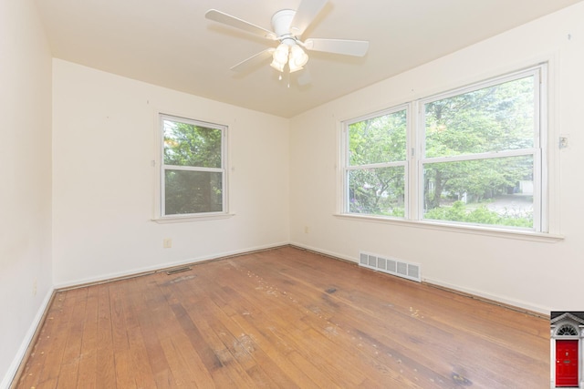 1506 Chandler Rd, Ann Arbor, MI 48105 - spare room featuring wood-type flooring, plenty of natural light, baseboards, and ceiling fan