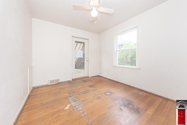 1506 Chandler Rd, Ann Arbor, MI 48105 - empty room with hardwood / wood-style flooring, a ceiling fan, and baseboards