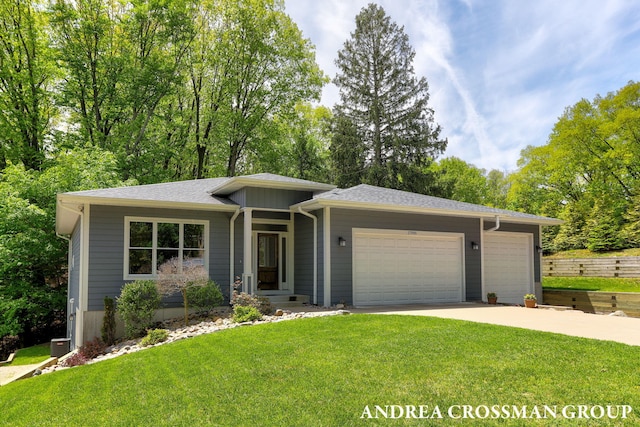 17946 Robbins Rd, Grand Haven, MI 49417 - view of front of home with a garage, concrete driveway, roof with shingles, and central AC unit