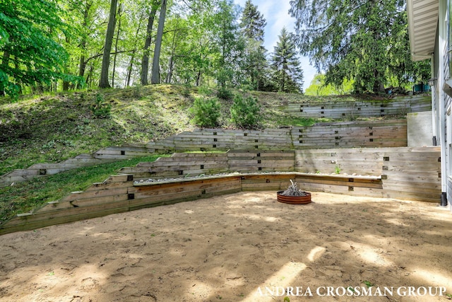 17946 Robbins Rd, Grand Haven, MI 49417 - view of yard featuring an outdoor fire pit