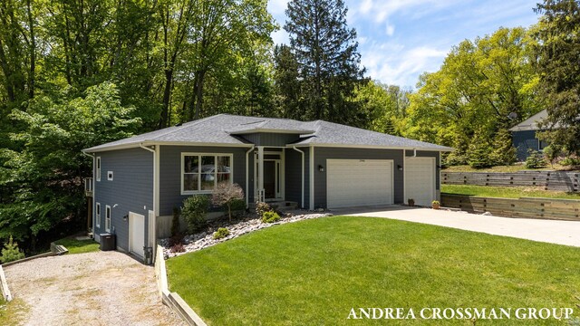 17946 Robbins Rd, Grand Haven, MI 49417 - view of front of home featuring concrete driveway and a garage