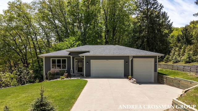 17946 Robbins Rd, Grand Haven, MI 49417 - view of front facade with driveway, a garage, a front lawn, and roof with shingles