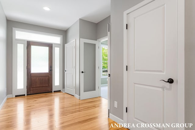 17946 Robbins Rd, Grand Haven, MI 49417 - foyer entrance with light wood-style flooring, baseboards, and recessed lighting