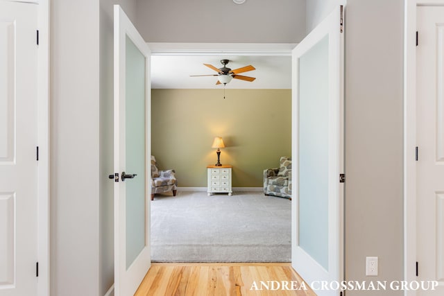 17946 Robbins Rd, Grand Haven, MI 49417 - hallway featuring light wood-style floors and light colored carpet