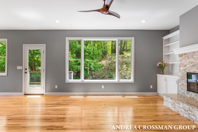 17946 Robbins Rd, Grand Haven, MI 49417 - unfurnished living room featuring wood finished floors, healthy amount of natural light, ceiling fan, and recessed lighting