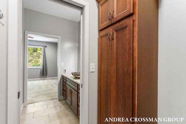 17946 Robbins Rd, Grand Haven, MI 49417 - bathroom featuring vanity, tile patterned floors, and baseboards