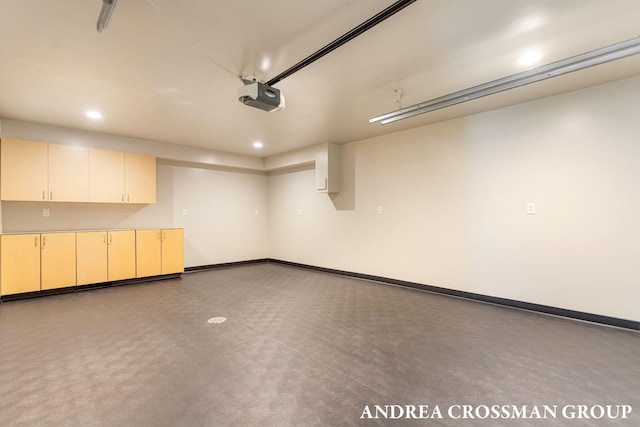 17946 Robbins Rd, Grand Haven, MI 49417 - garage with a garage door opener, recessed lighting, and baseboards