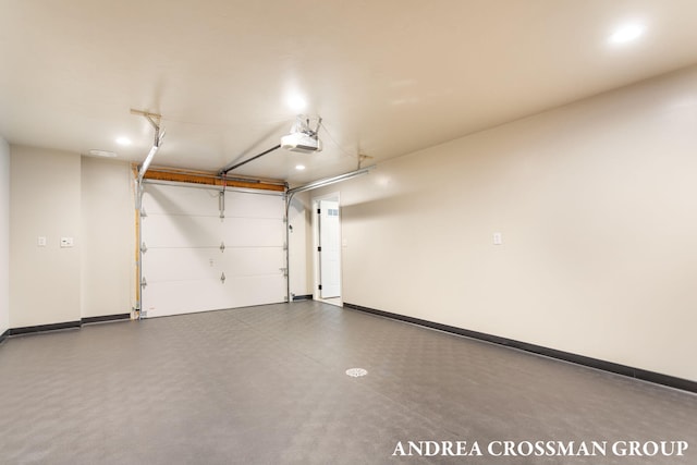 17946 Robbins Rd, Grand Haven, MI 49417 - garage featuring a garage door opener and baseboards