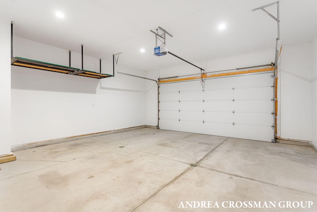 17946 Robbins Rd, Grand Haven, MI 49417 - garage featuring a garage door opener, recessed lighting, and baseboards