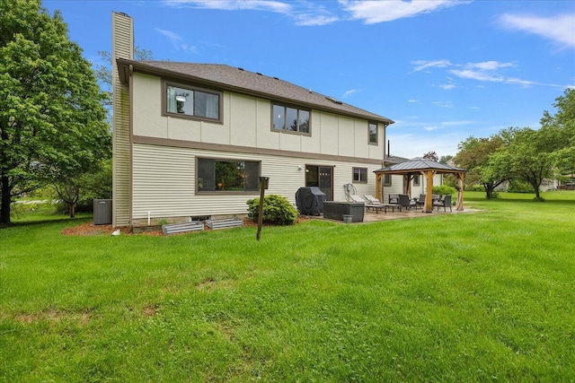 4047 Ramsgate Ct, Ann Arbor, MI 48103 - rear view of house featuring a gazebo, a patio area, a chimney, a lawn, and cooling unit