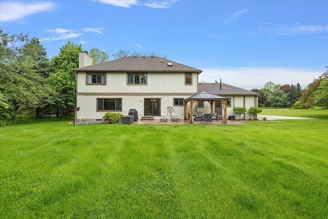 4047 Ramsgate Ct, Ann Arbor, MI 48103 - rear view of house featuring a gazebo, a chimney, a patio area, and a lawn