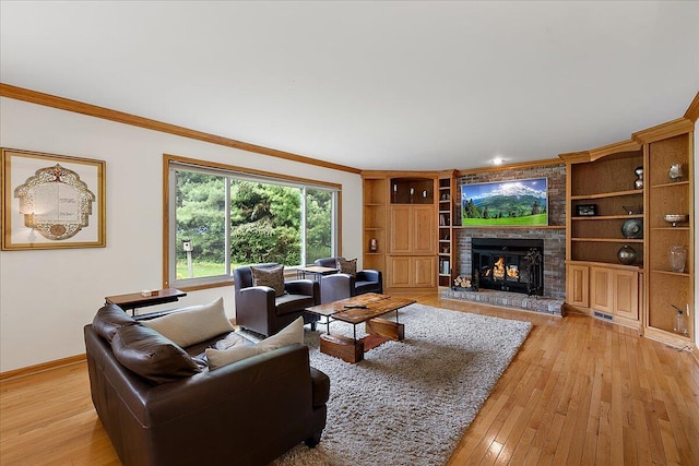 4047 Ramsgate Ct, Ann Arbor, MI 48103 - living room featuring crown molding, a brick fireplace, light wood-style floors, baseboards, and built in features