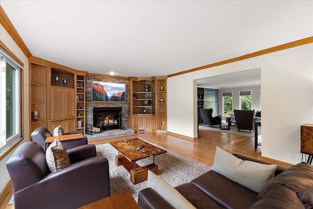 4047 Ramsgate Ct, Ann Arbor, MI 48103 - living area featuring crown molding, a fireplace, light wood finished floors, baseboards, and built in shelves