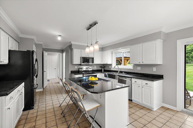4047 Ramsgate Ct, Ann Arbor, MI 48103 - kitchen with appliances with stainless steel finishes, a sink, light tile patterned flooring, white cabinetry, and a kitchen breakfast bar