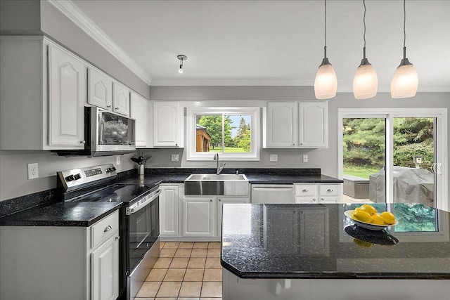 4047 Ramsgate Ct, Ann Arbor, MI 48103 - kitchen with stainless steel appliances, a sink, white cabinets, crown molding, and light tile patterned floors