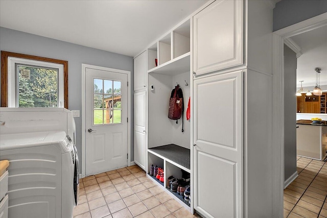 4047 Ramsgate Ct, Ann Arbor, MI 48103 - mudroom with light tile patterned floors and washing machine and dryer
