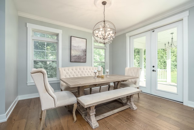 6606 Spaniel Dr, Kalamazoo, MI 49009 - dining area with a chandelier, french doors, ornamental molding, hardwood / wood-style floors, and baseboards
