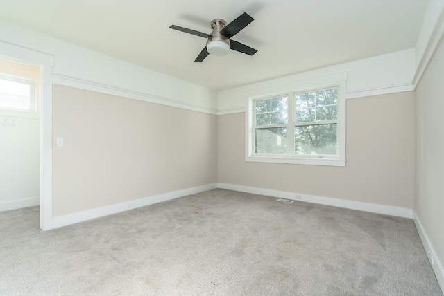 6606 Spaniel Dr, Kalamazoo, MI 49009 - empty room featuring healthy amount of natural light, a ceiling fan, carpet floors, and baseboards