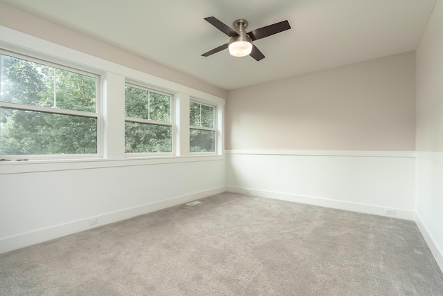 6606 Spaniel Dr, Kalamazoo, MI 49009 - spare room featuring a ceiling fan, carpet floors, and baseboards