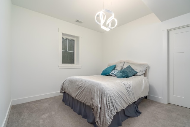 6606 Spaniel Dr, Kalamazoo, MI 49009 - carpeted bedroom featuring a chandelier and baseboards