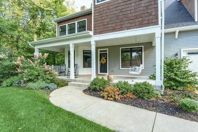 6606 Spaniel Dr, Kalamazoo, MI 49009 - view of front of property with covered porch, a chimney, a front yard, and roof with shingles