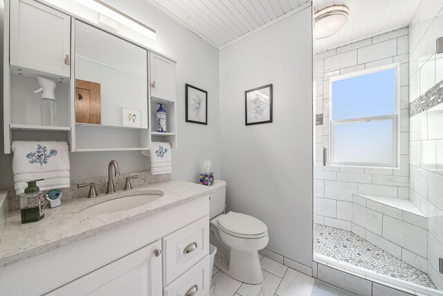 9787 Center Ln, Canadian Lakes, MI 49346 - bathroom featuring marble look tile flooring, a shower stall, toilet, vanity, and ornamental molding