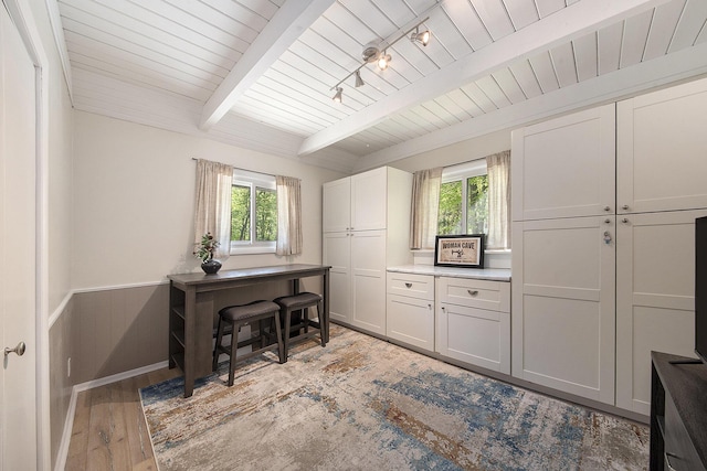 9787 Center Ln, Canadian Lakes, MI 49346 - home office with healthy amount of natural light, light wood-style flooring, wooden ceiling with exposed beams, and a wainscoted wall
