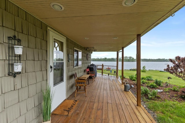 13341 Clausen Rd, Trufant, MI 49347 - wooden terrace with a water view