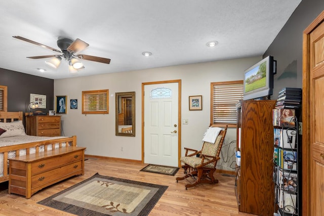 13341 Clausen Rd, Trufant, MI 49347 - foyer entrance featuring light wood finished floors, ceiling fan, baseboards, and recessed lighting