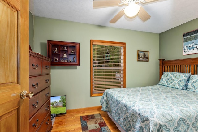13341 Clausen Rd, Trufant, MI 49347 - bedroom featuring light wood-type flooring and a ceiling fan