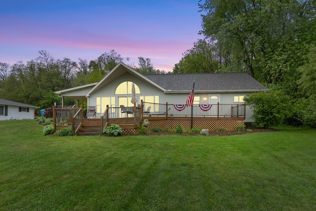 13341 Clausen Rd, Trufant, MI 49347 - view of front facade featuring a front lawn and a wooden deck