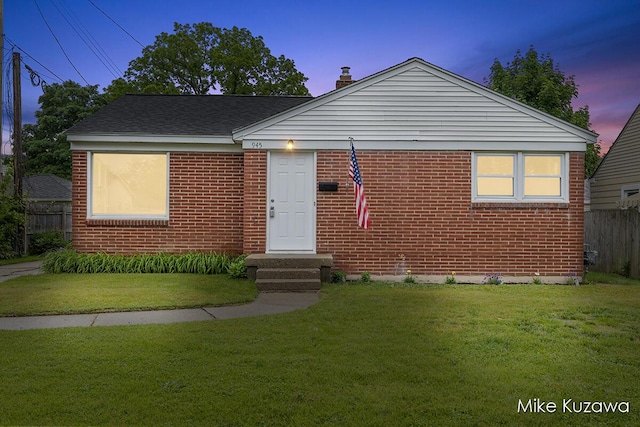 945 NW Dorothy St NW, Grand Rapids, MI 49504 - view of front of house featuring brick siding and a chimney