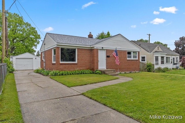 945 NW Dorothy St NW, Grand Rapids, MI 49504 - view of front of property featuring concrete driveway, a detached garage, brick siding, an outdoor structure, and a chimney