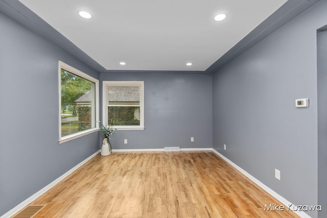 945 NW Dorothy St NW, Grand Rapids, MI 49504 - spare room with wood finished floors, recessed lighting, and baseboards